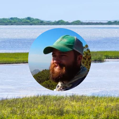 Mans face with wetland behind